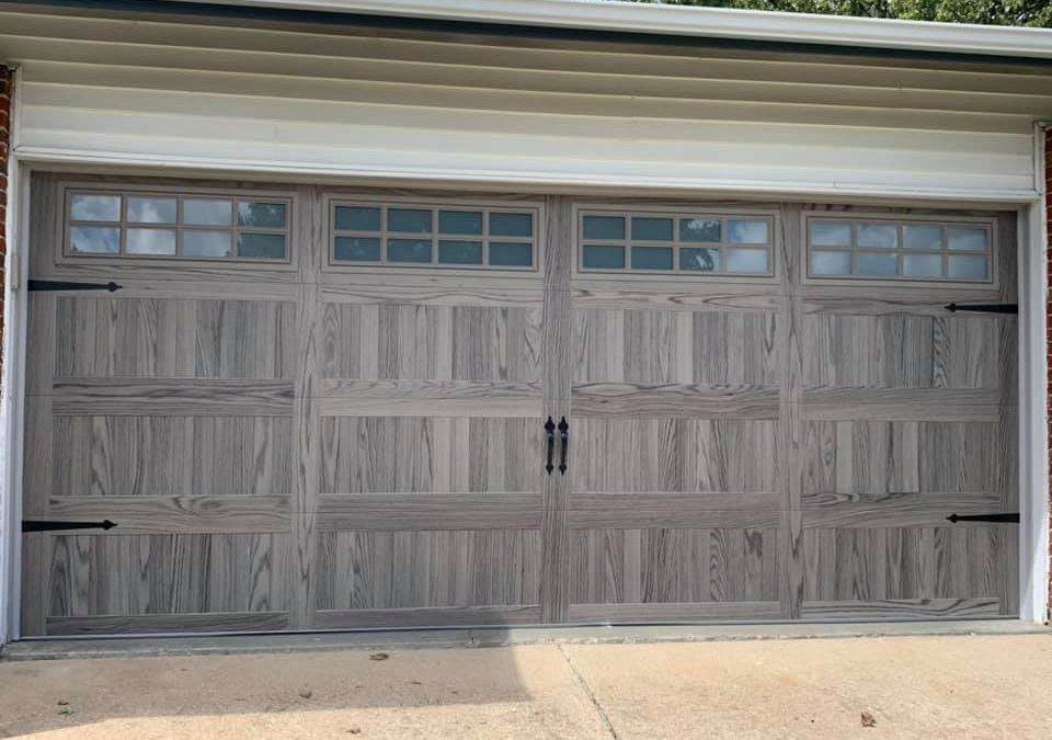 C.H.I. Stamped Carriage House Garage Door in Driftwood Finish