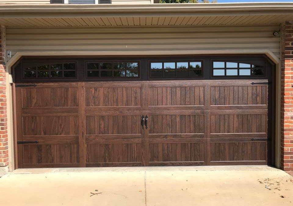 C.H.I. Stamped Carriage House Garage Door in Dark Oak Wood Finish