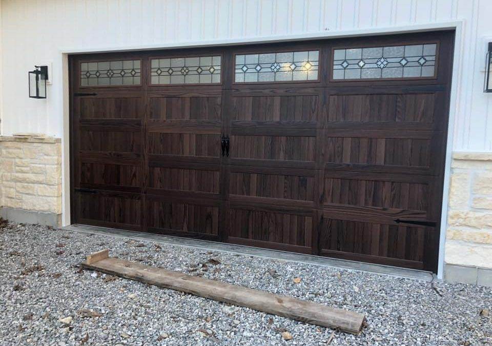 C.H.I. Stamped Carriage House Garage Door with Newport Designer Glass